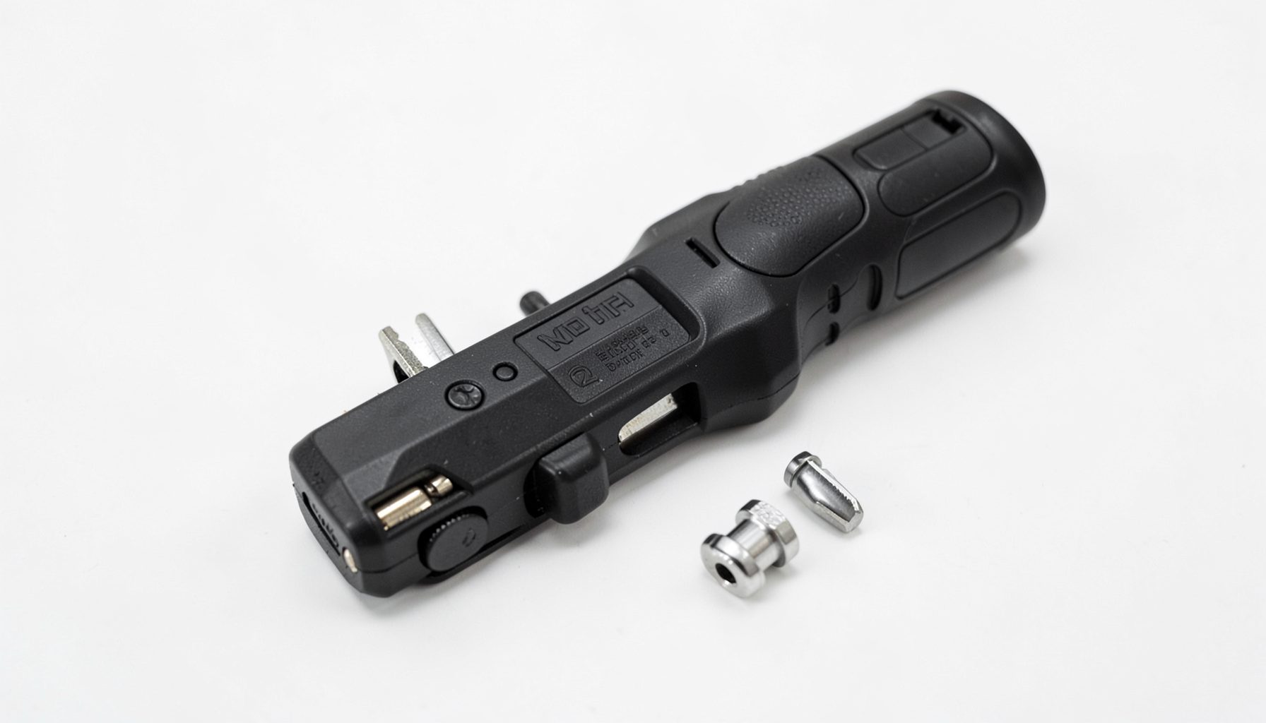 A compact cordless multi-tool with interchangeable heads on a clean white surface