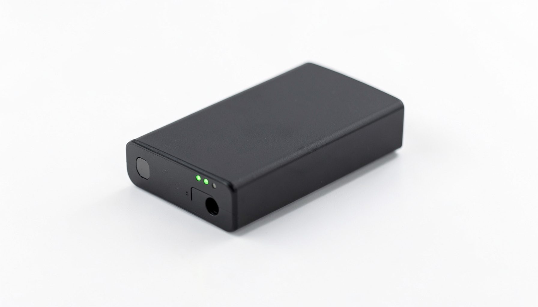 Sleek lithium-ion battery pack with dark casing and subtle green indicator lights, resting on a clean white surface